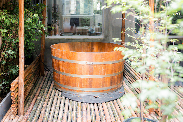 Wooden cedar hot tub in the garden